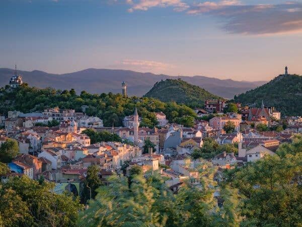 View of properties to rent in a Bulgarian small town at sunrise.
