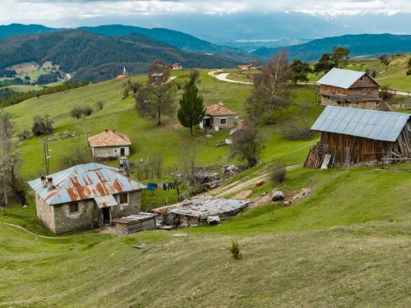 View of old farms on an agricultural land for sale in Bulgaria.