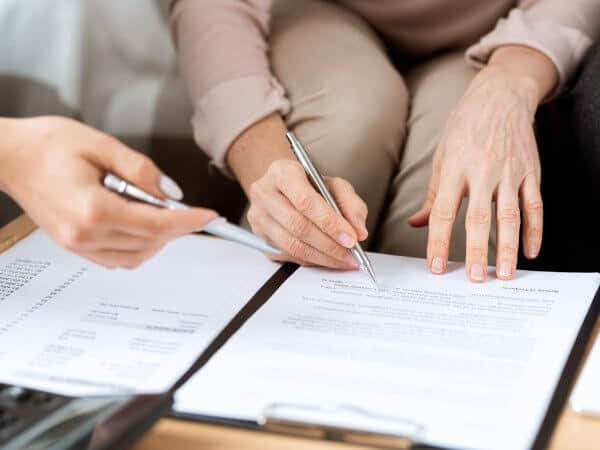 Buy Land in Bulgaria 7 A real estate agent and an investor signs a document to purchase land in Bulgaria.