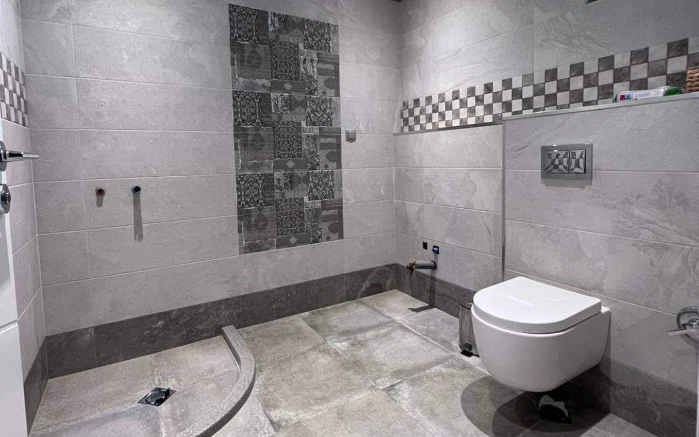 Unfinished bathroom with toilet seat