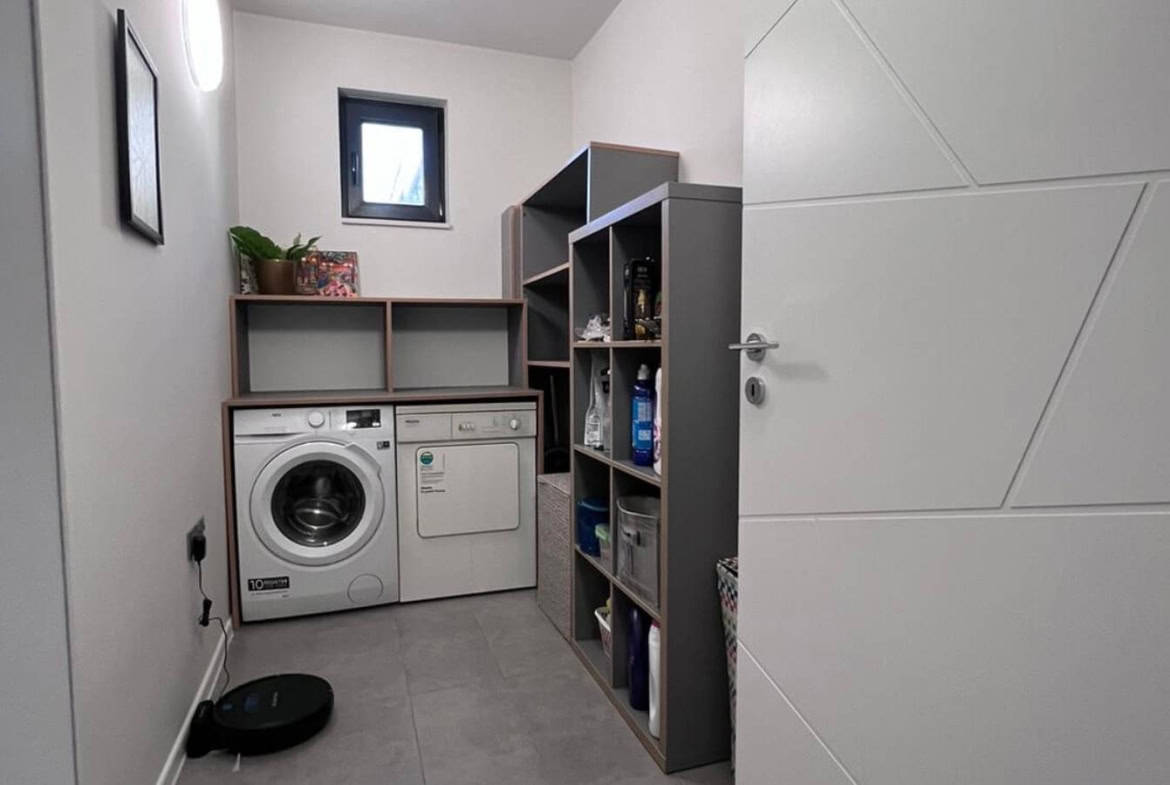Laundry room with washing machine and a dryer