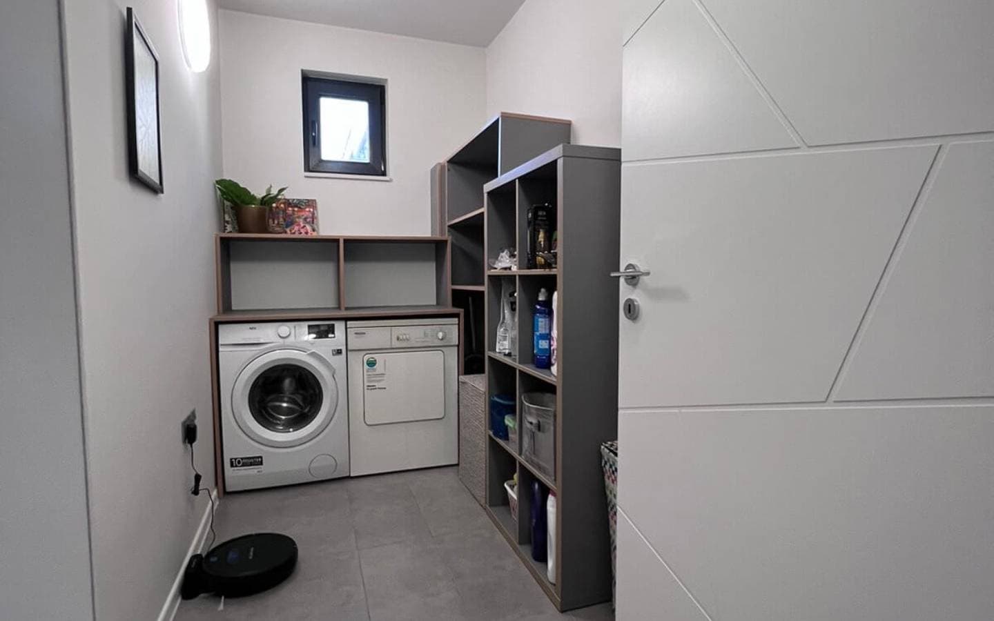 Laundry room with washing machine and a dryer