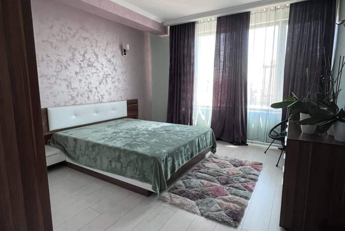 Purple bedroom with a double bed