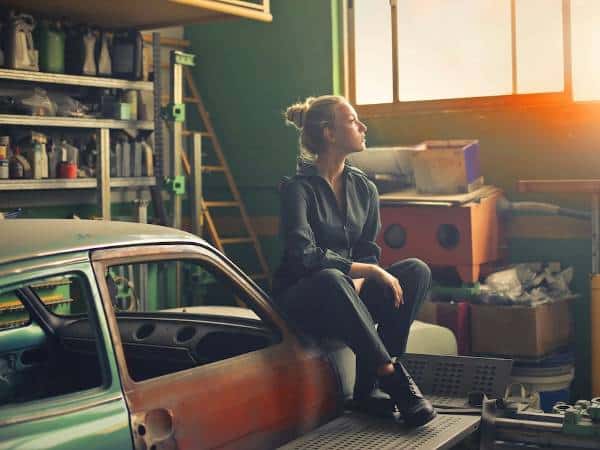 Garages for rent in Bulgaria 4 A Bulgarian female mechanic in her garage looking through the window.