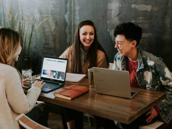 Real estate investors and owners around a table discussing the benefits of having their properties managed by BulgarIMOT.bg