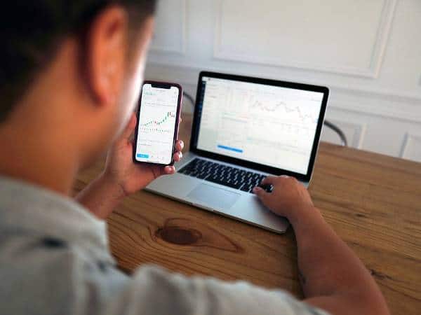 A real estate investor check the value of his properties on his laptop.