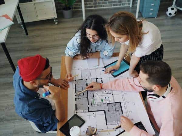 A team of coworkers around a table in an office for rent in Bulgaria.