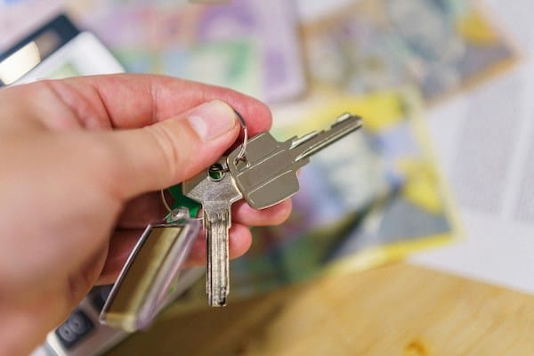 A hand holding keys of an apartment leased in Sofia Bulgaria.