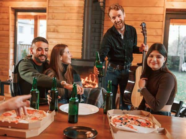 A group of friends eating pizzas in a Bulgarian restaurant.
