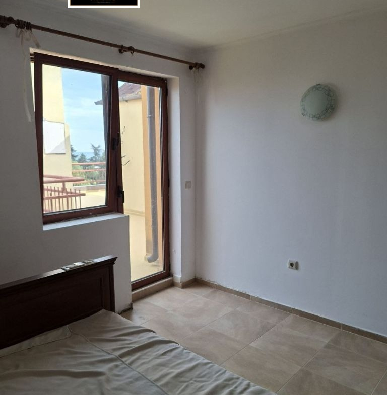Bright bedroom with balcony door and panoramic views