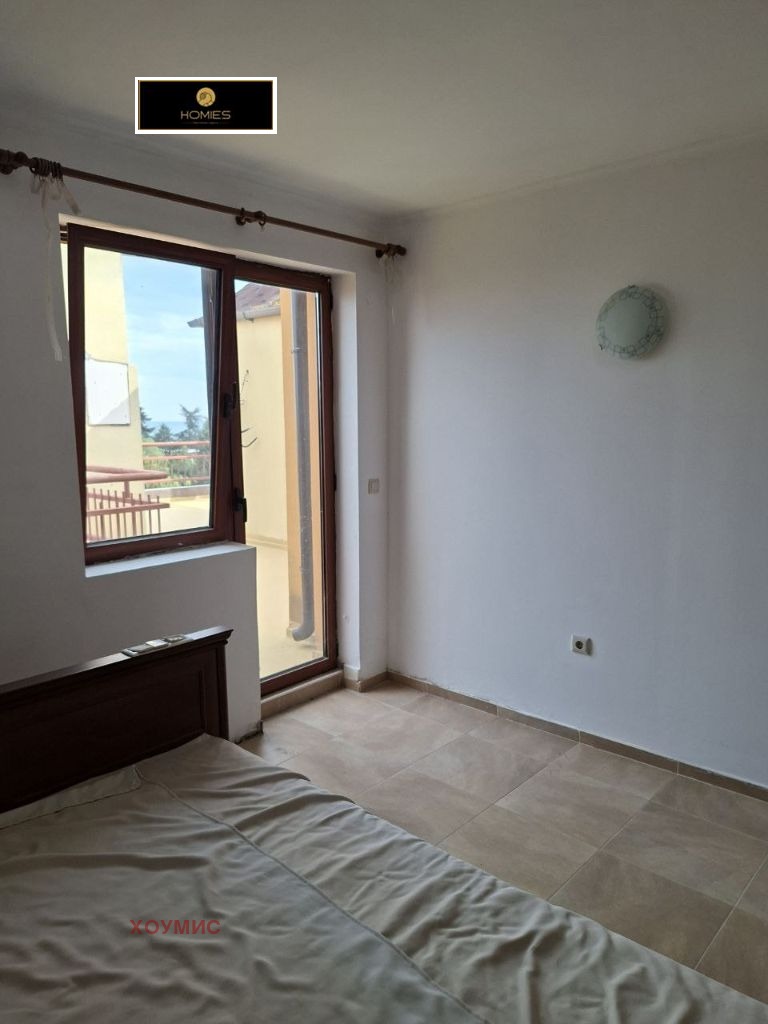 Bright bedroom with balcony door and panoramic views