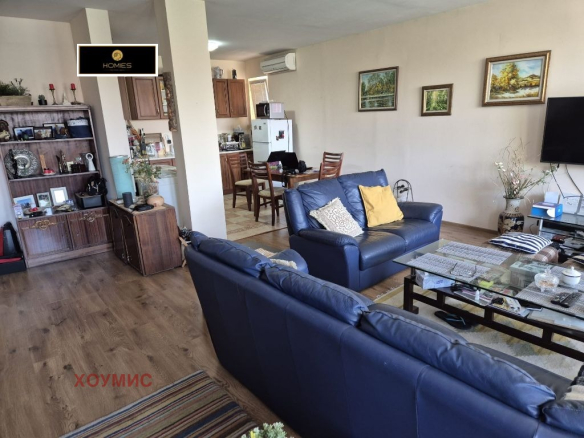 Spacious living room with leather sofa television