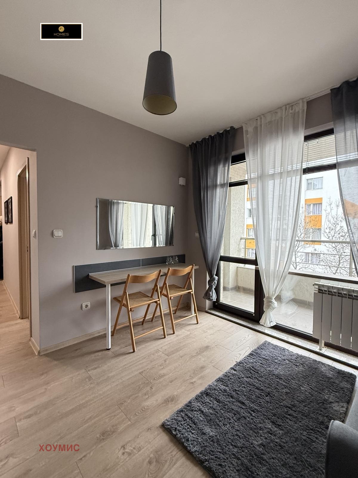 Modern living area with work desk and natural light