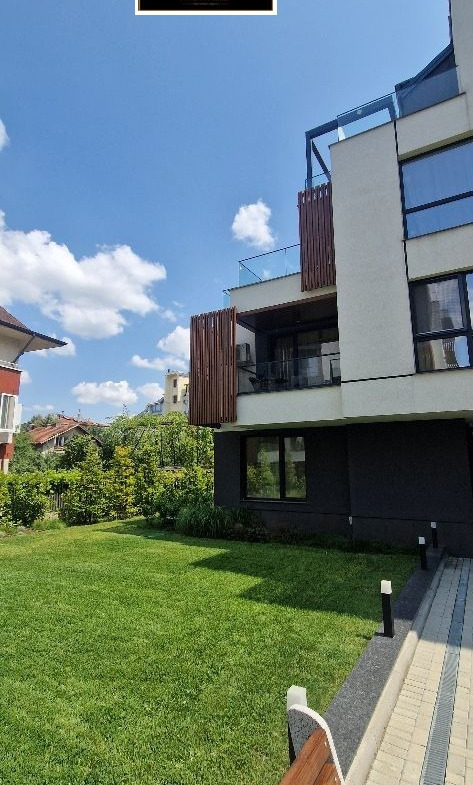 Modern two-story house with landscaped garden area